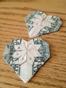 Make an origami heart out of a dollar bill